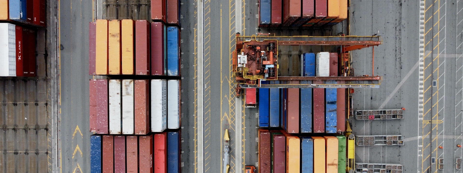Aerial view of stacked shipping containers at international port